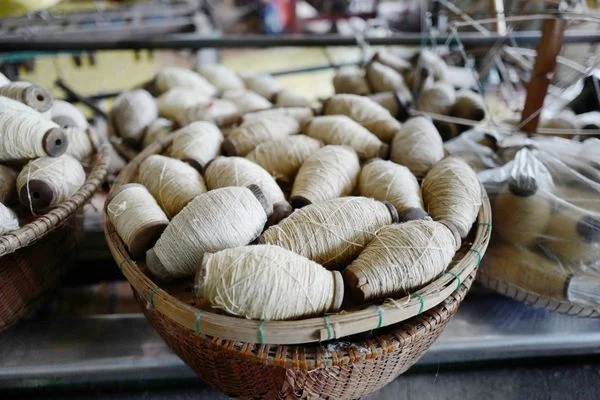 During the silk reeling process to unwind inpidual filaments for weaving, the thicker, coarser strands are segregated and used for handspun rustic silk textiles.&nbsp;&nbsp;
